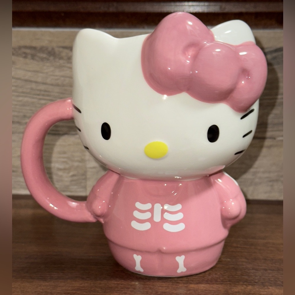 Hello Kitty Pink 3D sculpted ceramic mug featuring a skeleton design on the body